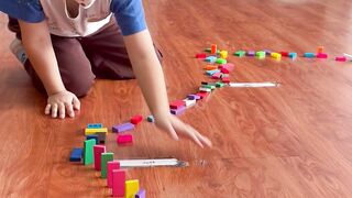 A child playing with the Dominoes in Classrooms