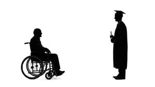 Graduation and Disability Awareness | Graduate Standing Before Man in Wheelchair