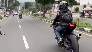 This couple is out riding their big motorcycles; they look really cool.