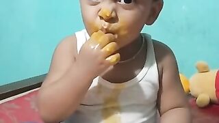 Raizaan eating mango