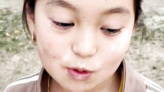 Little girl neighbor gives candy to Ana