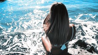 Blonde Woman Enjoying Peaceful Ocean View During Sunny Beach Holiday