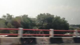 Highway bridge view from car window traveling indonesia
