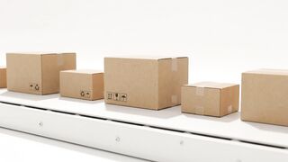 Cardboard boxes moving on conveyo