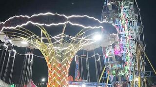 Night carnival glows with vibrant lights