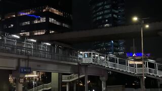 Nighttime urban traffic jams glow under city lights