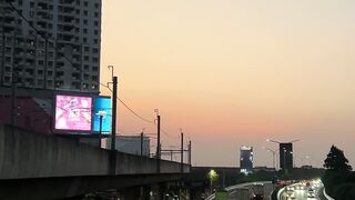 Sunset paints sky in warm amber hues