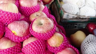 Fresh Fruits Display: Red Apples and Snake Fruit (Salak)