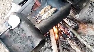 Traditional Wood-Fired Grilled Fish Cooking Over an Open Flame