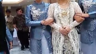 Beautiful Indonesian Traditional Bride in Elegant Golden Wedding Attire