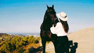 Graceful Horsewoman Riding and Training Horse in Summer Mountains