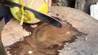 Green fresh young coconut water cutting skills