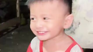 Funny Reaction of a 1.5-Year-Old Baby Watching Their Grandpa Take a Snake Out of a Sack
