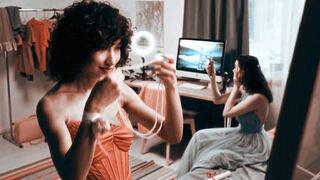 Teen Girl Wearing Elegant Pink Dress and Choosing Jewelry for Special Prom Night