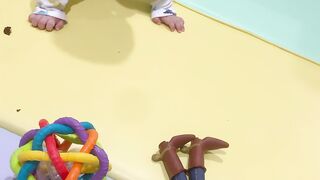 Baby reaching for a Toy