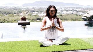 Relaxed Female Meditating in Lotus Pose During a Peaceful Summer Vacation