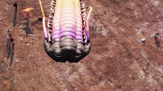 Aerial Top View Giant Rainbow Trilobite Kite Flying Low Over Field At Kite Festival Drone Shot