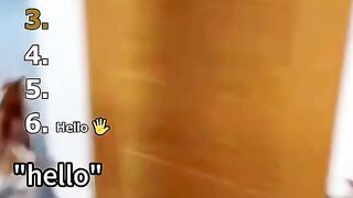 Funny talking cat meowing animatedly with expressive face on cozy couch