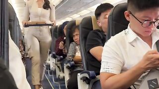 Beautiful Flight Attendant Serving Delicious Meals Onboard!