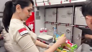 Beautiful Super Air Jet Flight Attendant Preparing for Onboard Sales