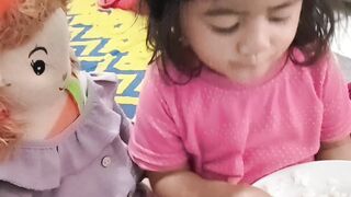 Daughter warning her doll