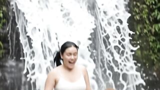 Beautiful woman with long-nosed monkey playing pelpsotan at waterfall but was stopped by crocodile