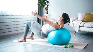 Pregnant Woman Using a Fitness Ball for Prenatal Exercise