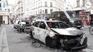 "Cars torched, shops looted at Paris protest"