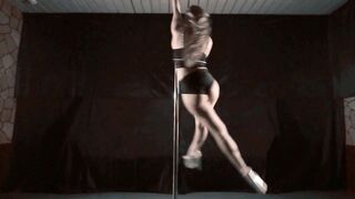 Beautiful Athletic Woman Combining Dance, Flexibility, and Strength on a Pole