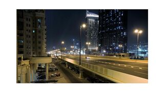 "City Streets at Night: A Busy Traffic View of Cars"