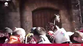 nturies-old traditional festival has crowds throw turnips at the "Jarramplas," a man dressed in multicoloured ,