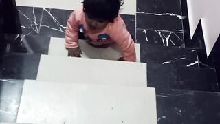 First steps of my daughter on steps .