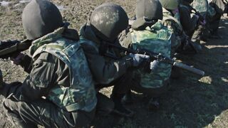 Soldier with guns are waiting helicopter Afghanistan video
