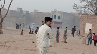 afghan boys playing football match in our village ground