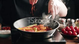 Chef frying pepper