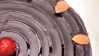 Yummy chocolate cake with almonds on top..