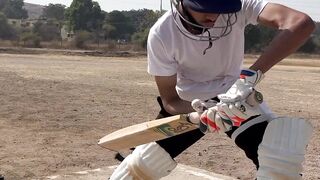 Small child playing cricket