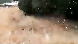 Snow falls on hills