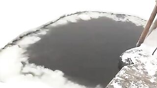 BATHING IN ICE-HOLE ON EPIPHANY