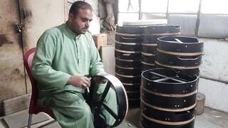 Sialkot.How does a craftsman make musical instruments?
