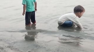 The children are bathing in River Swat