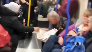 How this woman helps an old man in reading newspaper????