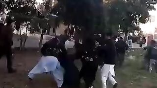 People throwing stones at the political leader