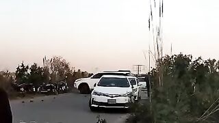 People are throwing stones on cars