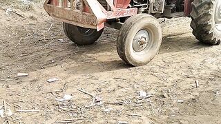 Boy drive tractor village street