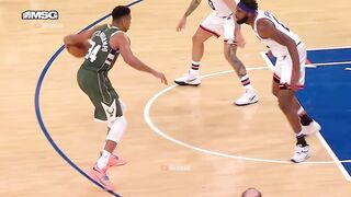 Giannis tries to bait the foul off the pump fake
