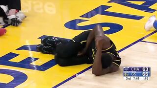Draymond Green is down in serious pain after Hayward knees him right in the beans