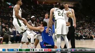 Giannis and Boban Marjanovic fighting for a loose ball 