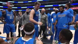 Luka Doncic coaches Mavericks teammates during a timeout