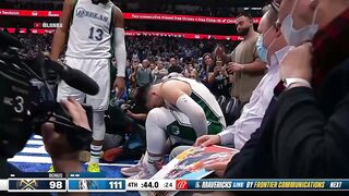 Luka Doncic leaves the game after Austin Rivers lands on his ankle